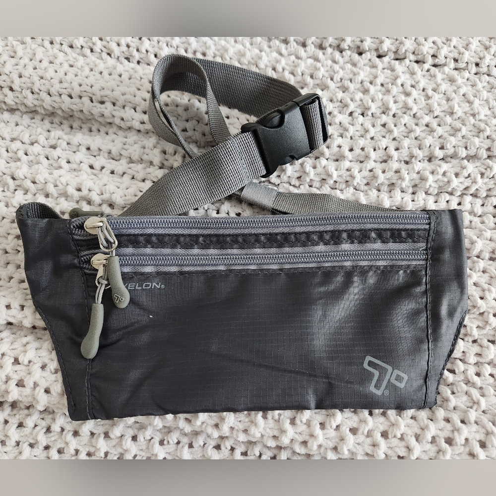 New Gray Crossbody Bag. Roomy With 2 Zippers In Front , One Zipper In Back.